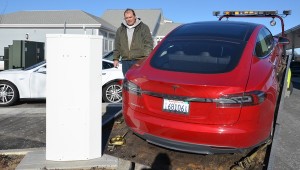 Tesla being loading onto a flat bed.  From the NYT